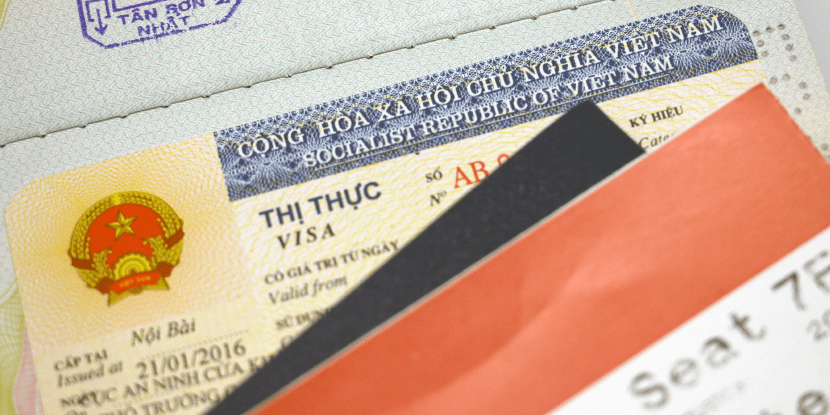 Vietnamese visa sticker in a passport. A visa sticker accompanied with travel documents